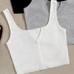 This is a white notch neck button up tank top